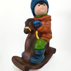 Niño en Caballo de Madera